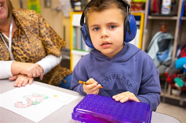 Students inside their classrooms learning. 